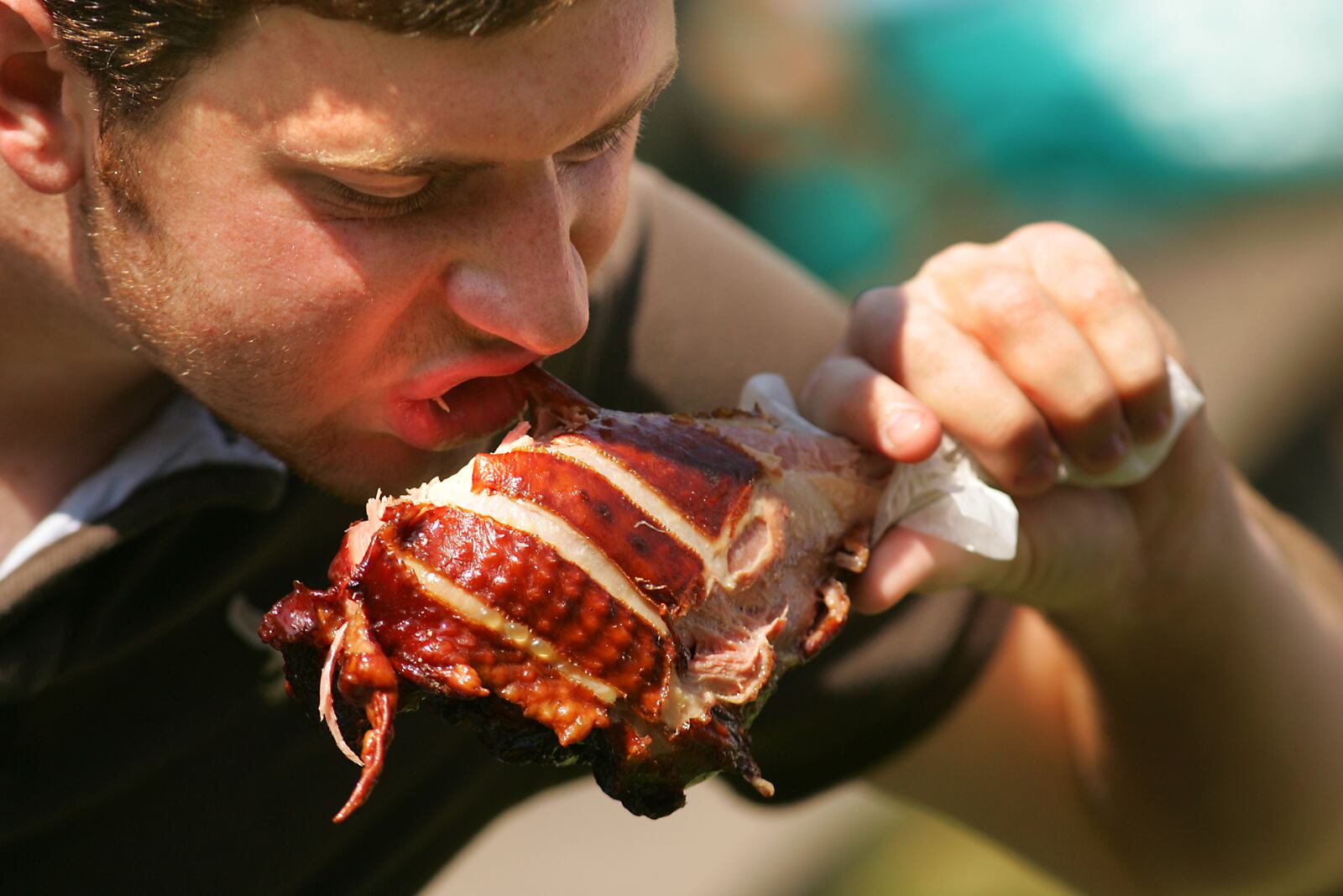 Ohio Renaissance Festival attendee Seth Roshon of Baltimore, OH bites into a turkety leg on the Renaissance Park grounds in Harveysburg, Ohio Saturday. The 19th annual festival opened Saturday and will run on Labor Day then on 8 weekends (Saturday and Sunday) through October 19. Staff Photo by Jim Witmer 08/30/08