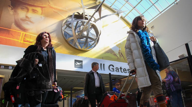 Travelers move through the lobby of the Dayton International Airport. Prepare to get to the airport early and ride on full or nearly full flights this Thanksgiving holiday season.The number of people traveling between Nov. 22 and Dec. 3 is expected to increase 1.5 percent this year to about 31,000 travelers per day, according to airline trade group Airlines For America. And flights are expected to be at least 85 percent full.And if you wait much longer to book any Christmas holiday flights, be ready to pay more. Last year, travelers who booked Christmas holiday flights in early December paid 28 percent more than those who booked flights earlier. And the price jumped 52 percent for flights booked after Dec. 10.
JIM WITMER / STAFF
