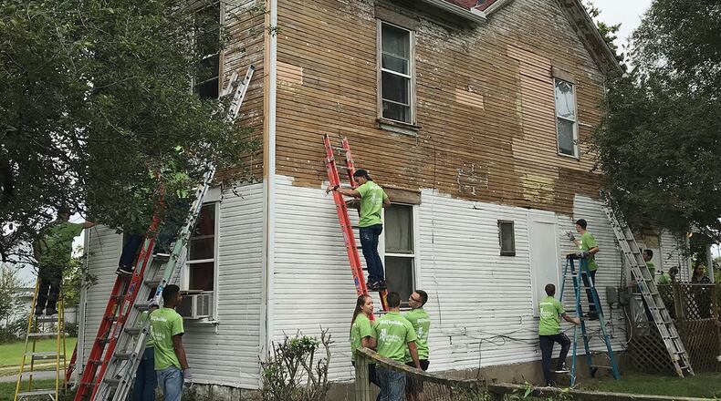 Around 100 WSU Air Force ROTC students worked with UD and Cedarville students to clean up a Dayton neighborhood last month.