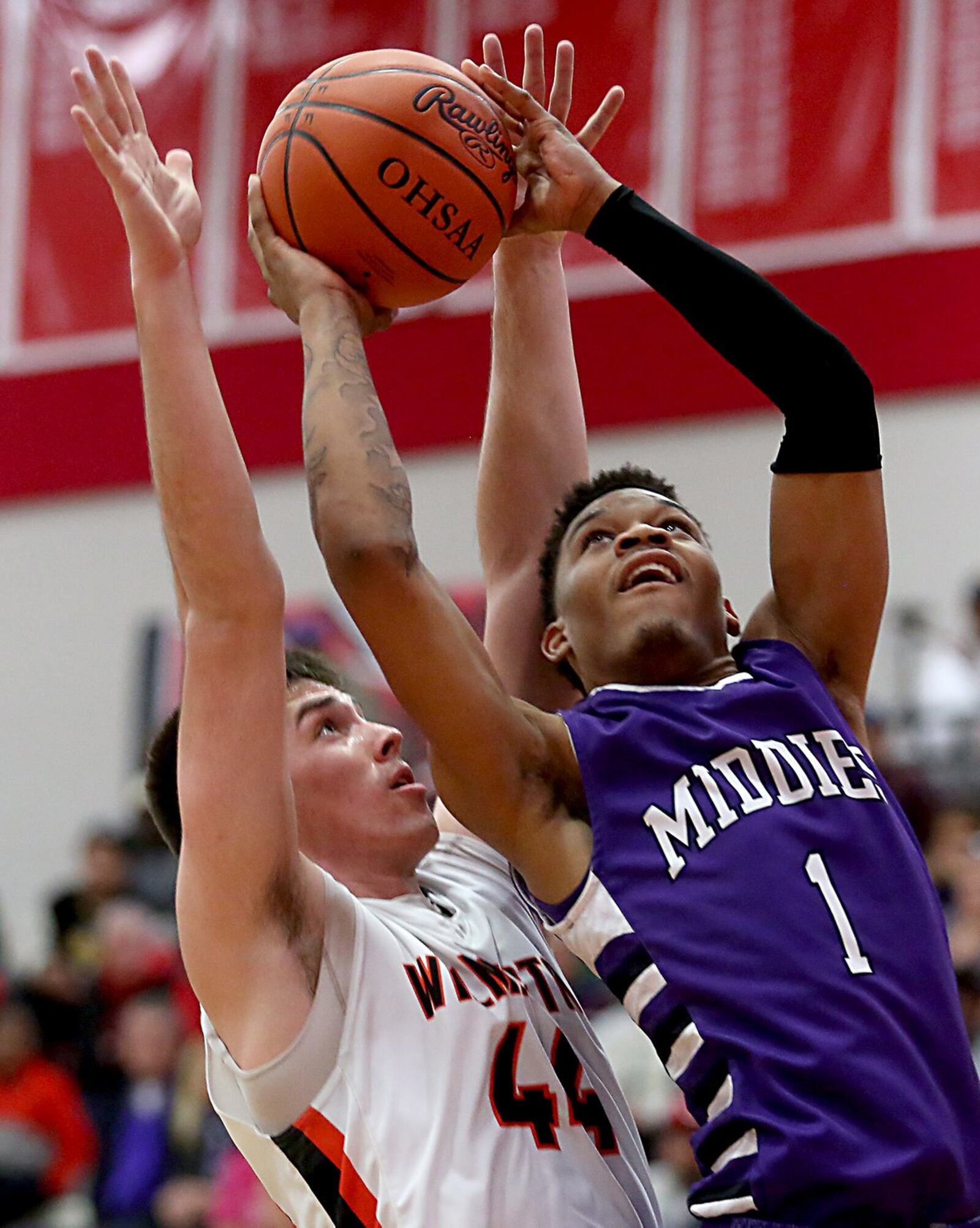 Middletown guard Nelson Rutledge puts up a shot as Wilmington forward Chris Wolary defends during their Division I sectional game at Fairfield Arena on Tuesday night. CONTRIBUTED PHOTO BY E.L. HUBBARD