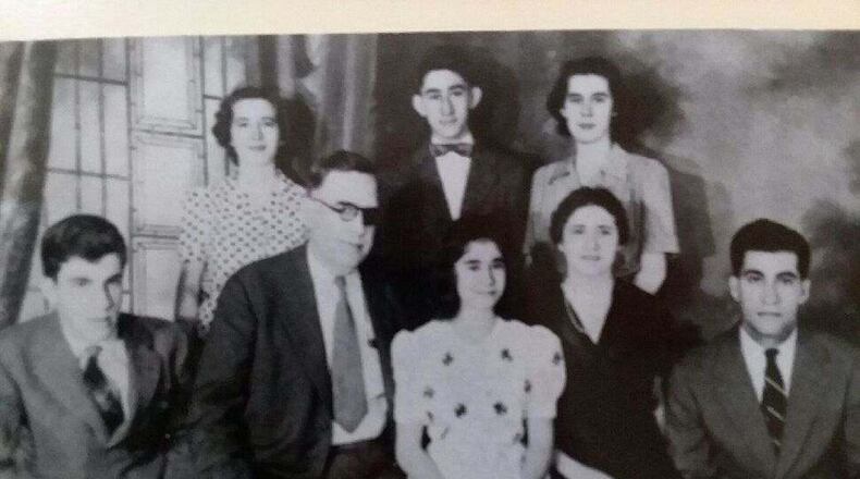 Albert B. Oberst, wearing an eye patch, gave a pocket watch to his son, Jim Oberst, middle back row. Oberst then gave the watch to his son, Albert Oberst. The watch was stolen 23 years ago during a home invasion, then it turned up recently in Middletown. SUBMITTED PHOTO