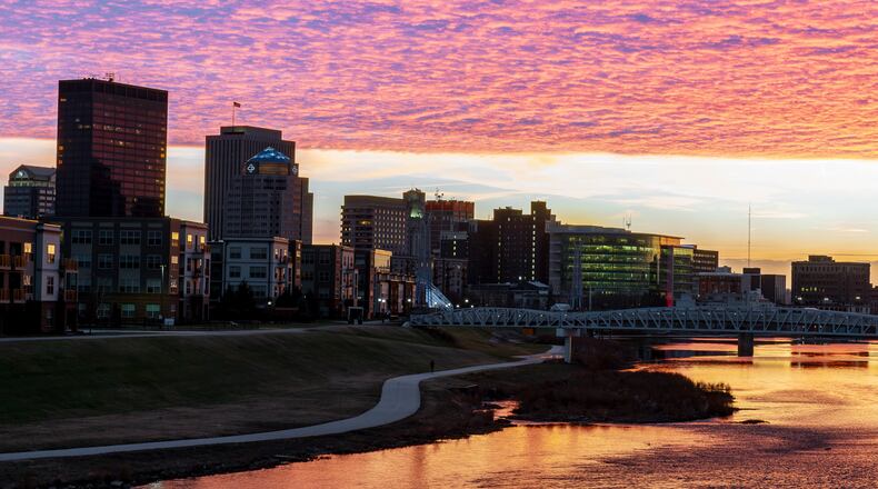 A view of downtown Dayton looking southwest on the Webster Street bridge during sunset on Monday, Dec. 22. BRYANT BILLING/STAFF