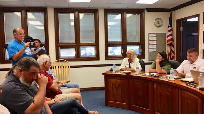 Madison Local Schools resident Billy Ison tells local school board members they are ignoring the wishes of some in the community by moving ahead with a new policy that would allow properly trained staffers access to firearms. The board’s regularly scheduled meeting Monday evening saw members take no action and make no comments in response to the few residents who echoed Ison’s stance. MICHAEL D. CLARK/STAFF