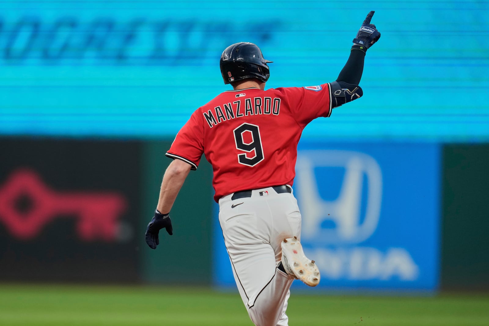 Cleveland Guardians' Kyle Manzardo (9) gestures as he runs the bases with a home run in the fifth inning of a baseball game against the Baltimore Orioles in Cleveland, Monday, July 21, 2025. (AP Photo/Sue Ogrocki)