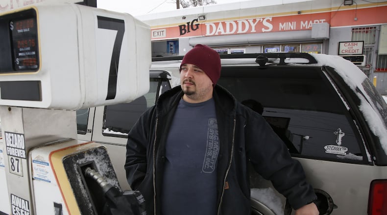 Dayton resident Alex Smith, 26, doesn’t like the idea of more taxes on gasoline, but added, “Maybe they’ll fix some of these roads and bridges.” TY GREENLEES / STAFF