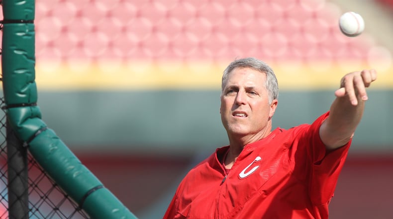 Reds manager Bryan Price throws batting practice on Friday, April 14, 2017, at Great American Ball Park in Cincinnati. David Jablonski/Staff