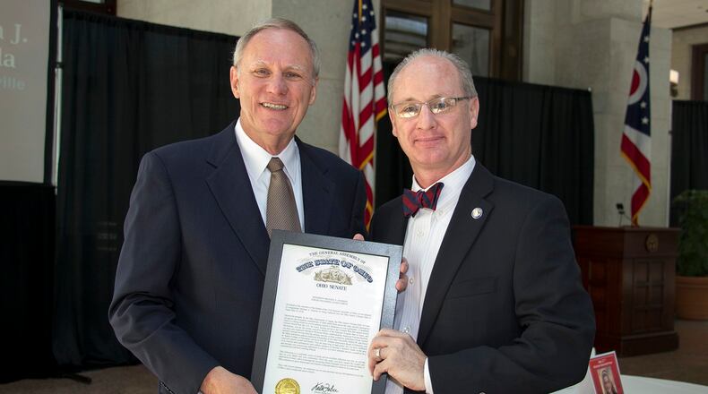 Mike Jackson (left) of Tipp City is recognized by State Sen. Bill Beagle of Tipp City at the May 19 Ohio Senior Citizens Hall of Fame induction at the Ohio Statehouse. CONTRIBUTED