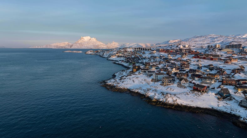 FILE - Houses are seen near the coast of a sea inlet of Nuuk, Greenland, on Sunday, Jan. 25, 2026. (AP Photo/Evgeniy Maloletka, File)