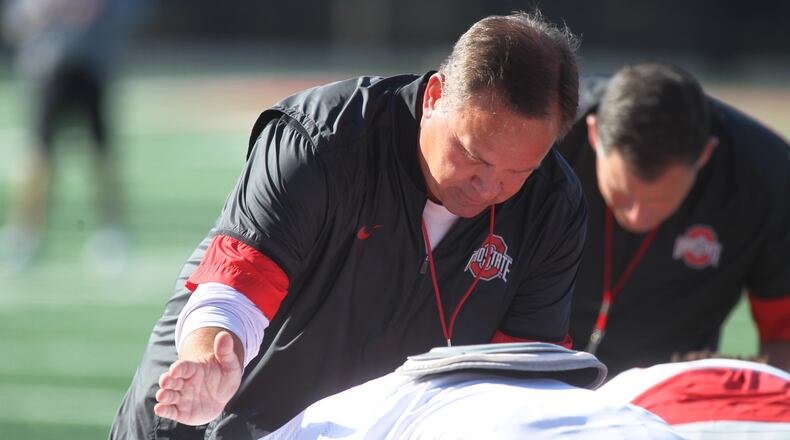 Ohio State coach Kevin Wilson talks to a player during practice on Saturday, Aug. 5, 2017, at the Woody Hayes Athletic Center in Columbus. David Jablonski/Staff