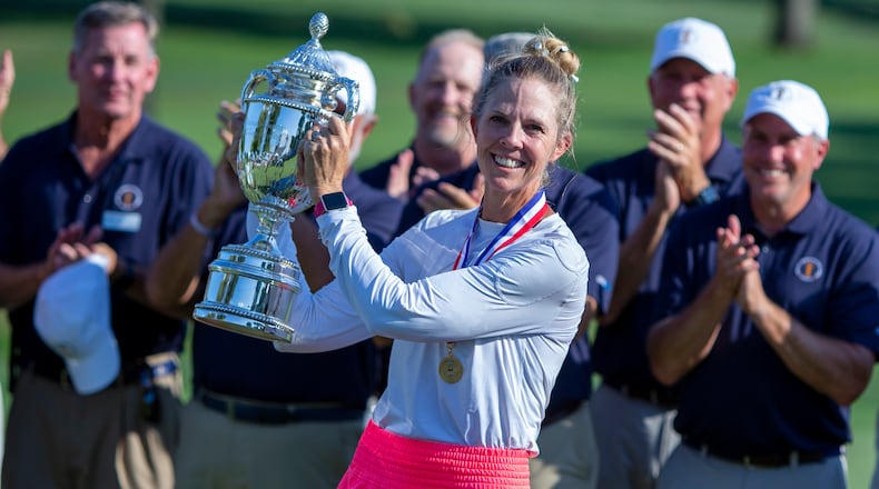 Jill McGill holds her trophy after winning the U.S. Senior Women's Open golf tournament at NCR Country Club in Kettering, Sunday, Aug. 28, 2022. It was the first professional win of her career. Jeff Gilbert/Dayton Daily News