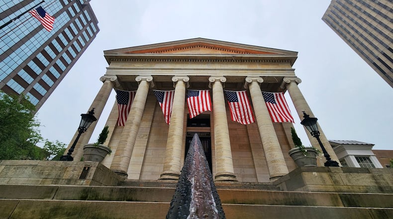 Flags are hanging from Montgomery County's Old Court House for NATO event in downtown Dayton Tuesday, May 20, 2025. NICK GRAHAM/STAFF