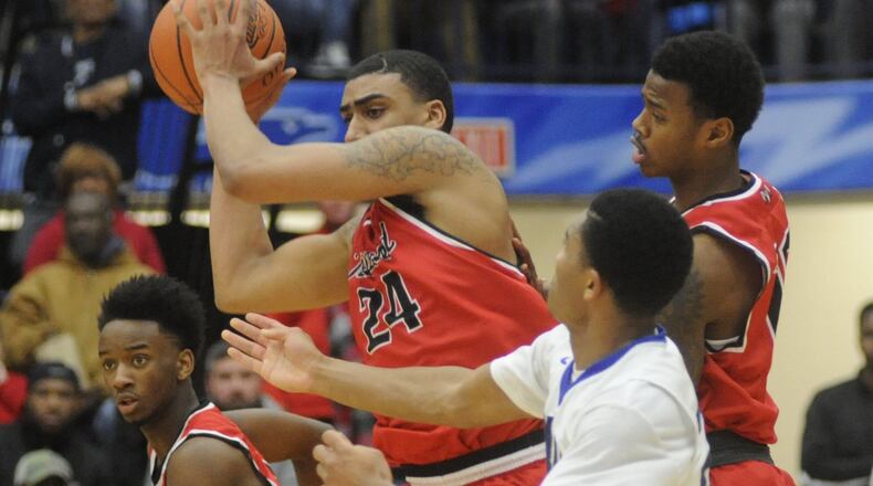 Torrey Patton of Trotwood-Madison (with ball) was named the D-II All-Ohio co-player of the year. MARC PENDLETON / STAFF