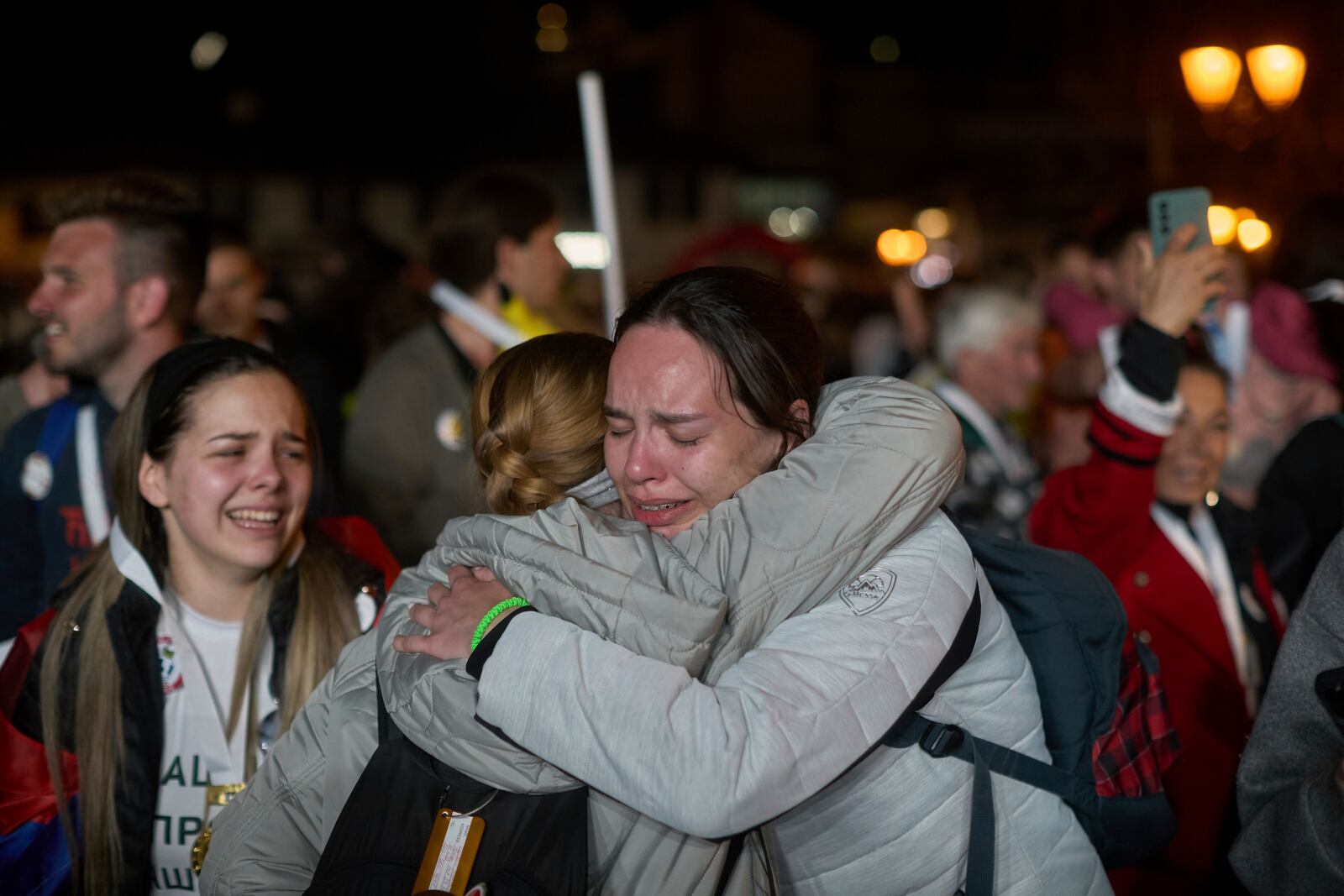 Students who walked across the country hug and cry as their group arrive at an anti-corruption protest in the southwestern town of Novi Pazar, Serbia, Friday, April 11, 2025. (AP Photo/Marko Drobnjakovic)