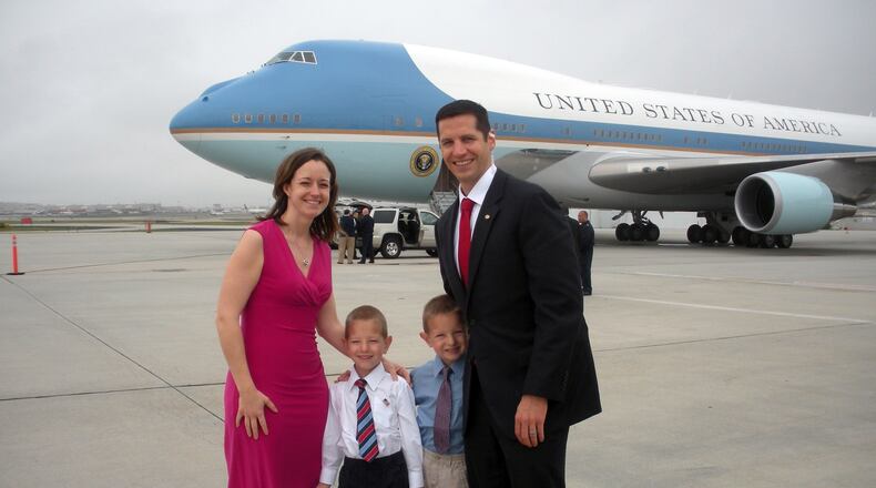 Family - Jeff Guttman, a Beavercreek native and Carroll High School graduate, attended Miami University on a ROTC scholarship. He eventually trained to become a pilot in the US Air Force. He (far right) is shown with his wife Megan (L) and twin boys Jake and Ryan. Guttman decided to step down from active duty and is now dedicating his time to his family while continuing to serve in the Air Force Reserves. SUBMITTED PHOTO