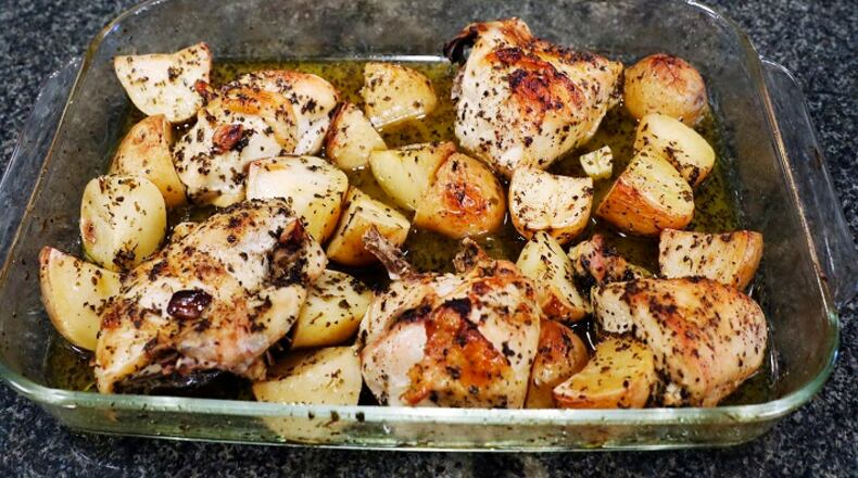 The finished classic Greek lemon chicken and potatoes prepared by Christina Moros and her grandmother, Christina Zarras in the home of Maria Beys in Dallas on Wednesday, Sept. 13, 2017. (David Woo/The Dallas Morning News/TNS) NO MAGAZINE SALES MANDATORY CREDIT; NO SALES; INTERNET USE BY TNS CONTRIBUTORS ONLY