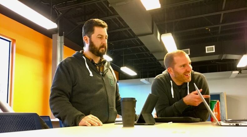 Jeff Graley, Mile Two co-founder and president (left), and Alex Morison, Mile Two’s chief science officer, at work at the company’s Tech Town offices. THOMAS GNAU/STAFF