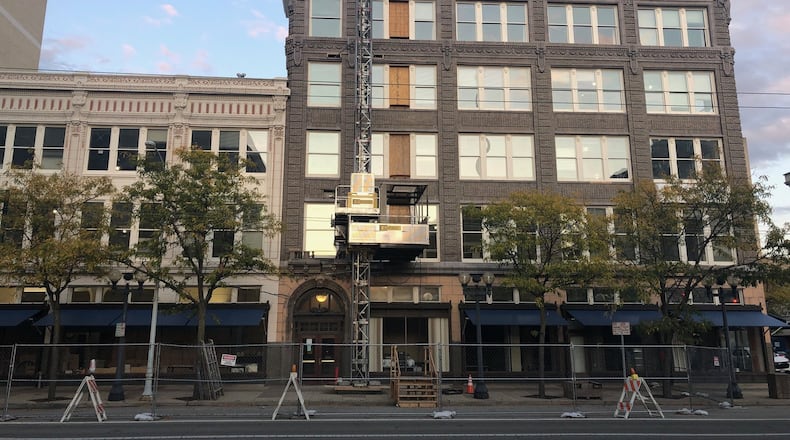 Work continued this week on the new headquarters complex for Dayton Public Schools, at 124-136 S. Ludlow St., across the street and half a block down from the existing office. JEREMY P. KELLEY / STAFF