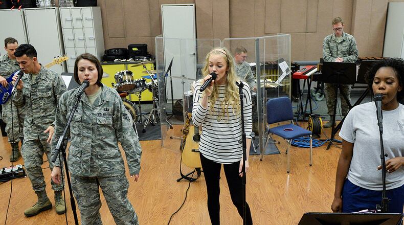 Singer Alexis Gomez rehearses with the U.S. Air Force Band of Flight inside the band’s offices at Wright-Patterson Air Force Base. Gomez will do a joint concert with the band Oct. 13 at the National Museum of the U.S. Air Force. (U.S. Air Force photos/Wesley Farnsworth)