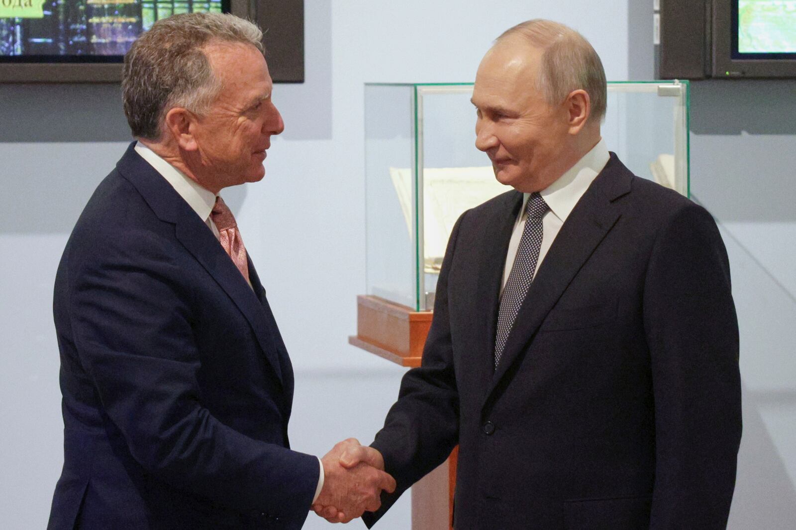 Russian President Vladimir Putin, right, and U.S. President Donald Trump's special envoy Steve Witkoff greet each other prior to their talks in St. Petersburg, Russia, Friday, April 11, 2025. (Gavriil Grigorov, Sputnik, Kremlin Pool Photo via AP)