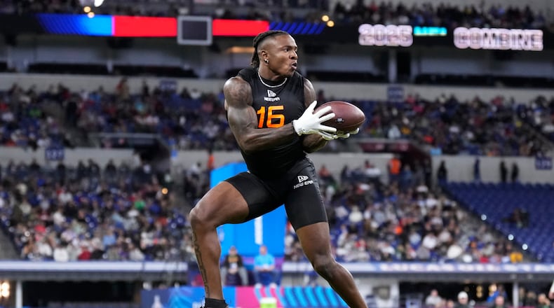 Iowa running back Kaleb Johnson runs a drill at the NFL football scouting combine in Indianapolis, Saturday, Feb. 1, 2025. (AP Photo/George Walker IV)
