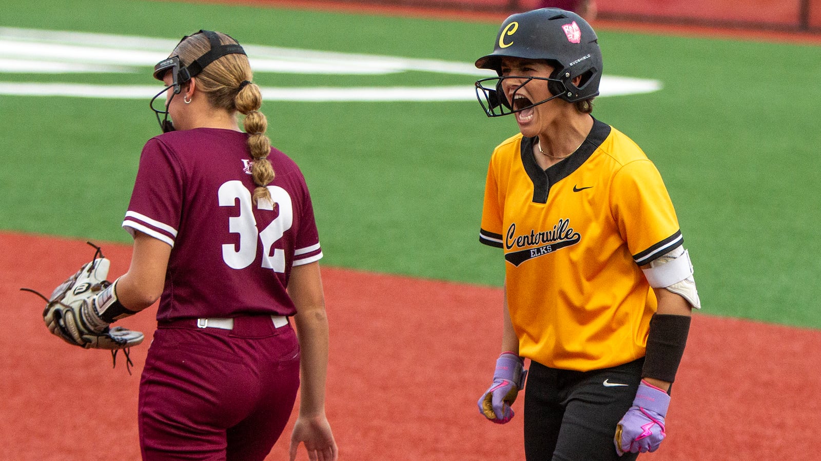 Centerville's Hannah O'Connor celebrates a single, her team's first hit, in the second inning of Sunday night's state final. Jeff Gilbert/CONTRIBUTED