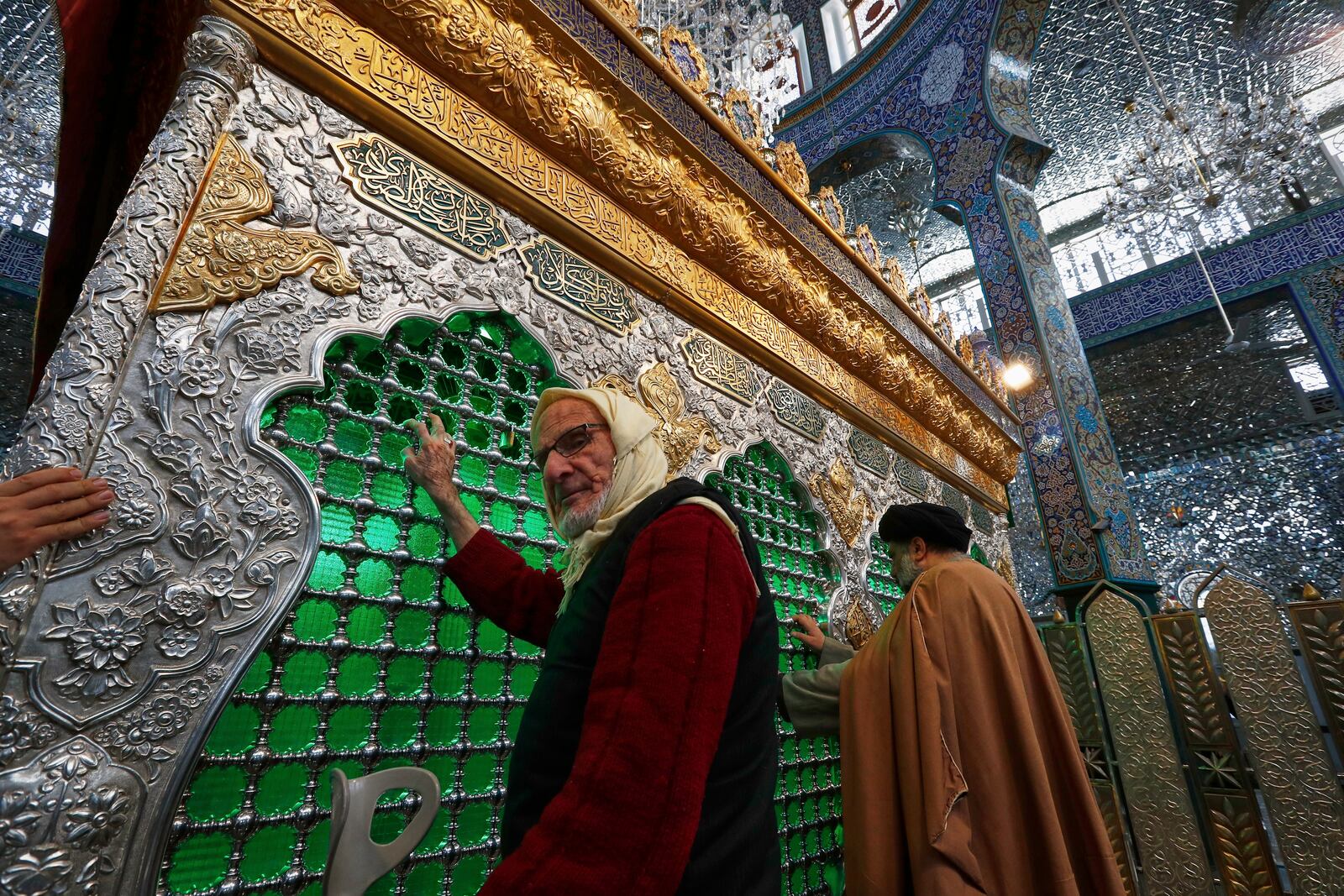 Shiite worshippers pray at the Sayyida Zeinab shrine where many Shiite Muslims believe Zeinab, the granddaughter of Prophet Muhammad is entombed, in Sayyida Zeinab, south of Damascus, Syria, Saturday March 15, 2025.(AP Photo/Omar Sanadiki)