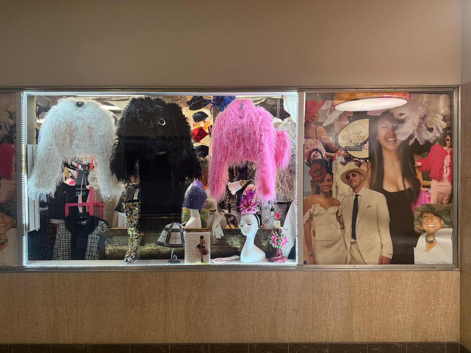 Images of Crawford’s Derby customers donning their headwear cling to the windows of Secret Beauty Boutique and Hats in downtown Dayton’s Talbott Tower. HANNAH KASPER/CONTRIBUTED