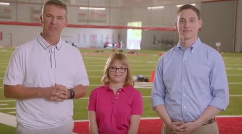 Ohio Treasurer Josh Mandel appears with Ohio State University football coach Urban Meyer touting STABLE savings accounts for people with special needs children.