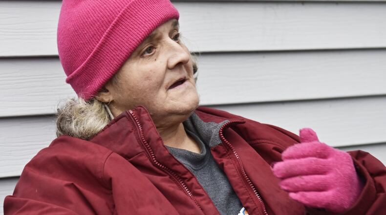 Karen Freeman, who lost several family members in a 1988 Hamilton fire, one of the city’s worst, talks about the fire and the memorial plaque recently installed at John R. Moser Park at 664 Heaton Street in memory of seven people who lost their lives in the fire. Neighborhood residents put up the marker to remember the deceased. NICK GRAHAM/STAFF