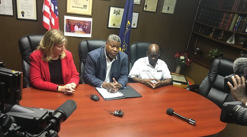 PHOTO: Dayton Mayor Nan Whaley, Dayton Unit NAACP President Derrick Foward and Willie Terrell Jr. (Mike Burianek/Staff)