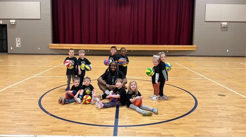 Bri Kreider – “Coach Bri” to her Bitty Ballers – pictured with her young basketball players on Wednesday. CONTRIBUTED