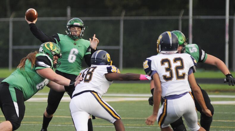 Northmont QB Miles Johnson, shown here last season against Springfield, threw three TD passes for the South All-Stars. MARC PENDLETON / STAFF