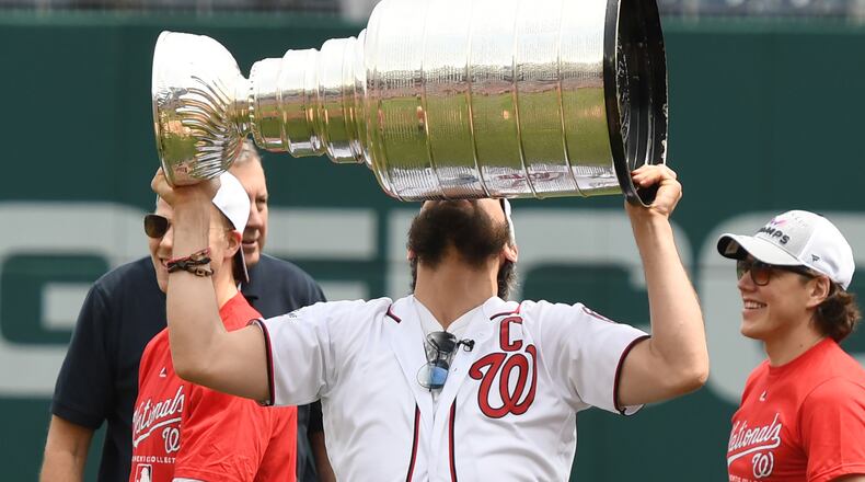 WASHINGTON, DC - JUNE 09: Alex Ovechkin of the Washington Capitals raises the Stanley Cup as the team is honored before a baseball game between the Washington Nationals and the San Francisco Giants at Nationals Park on June 9, 2018 in Washington, DC. (Photo by Mitchell Layton/Getty Images)