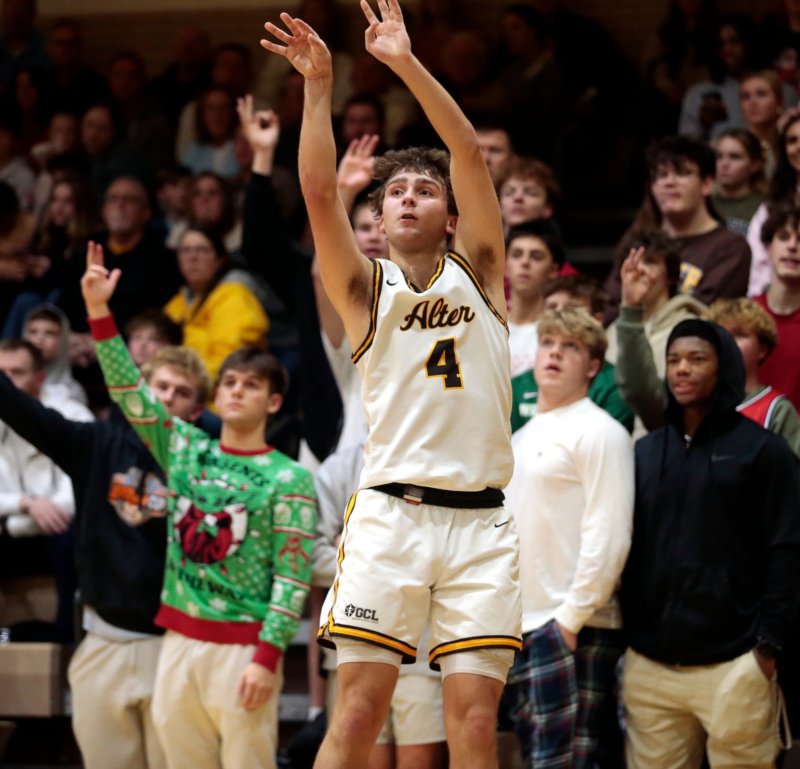Alter junior Thomas Nicholas attempts a three-point show from the corner during a 78-48 win against Carroll on Tuesday., Dec. 9, 2025, in Kettering. STEVEN WRIGHT / STAFF
