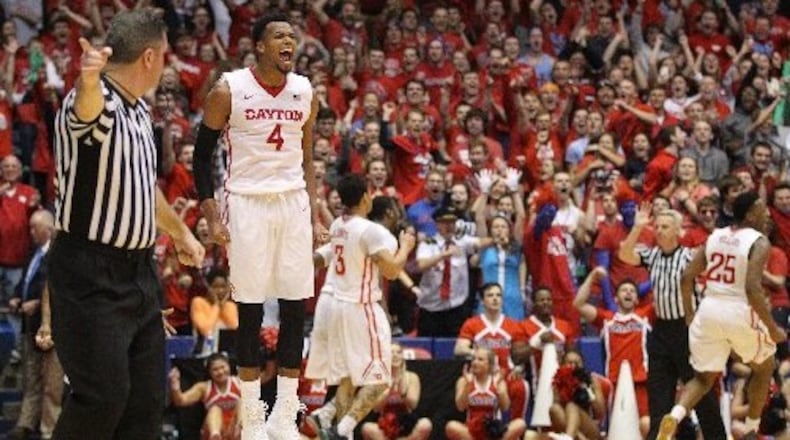 Dayton’s Charles Cooke reacts after forcing a turnover in the final minute against Duquesne on Tuesday, Feb. 9, 2016, at UD Arena in Dayton. David Jablonski/Staff