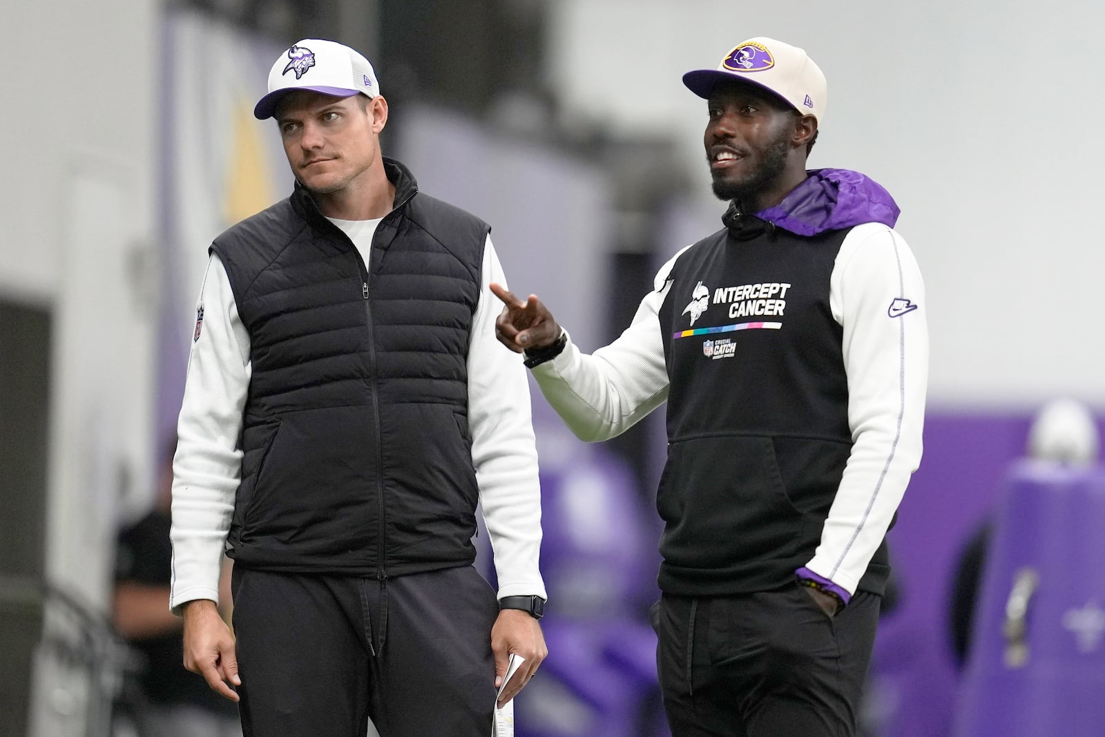 FILE - Minnesota Vikings head coach Kevin O'Connell, left, and general manager Kwesi Adofo-Mensah chat on the field during an NFL football practice in Eagan, Minn., Wednesday, Oct. 30, 2024. (AP Photo/Abbie Parr, File)