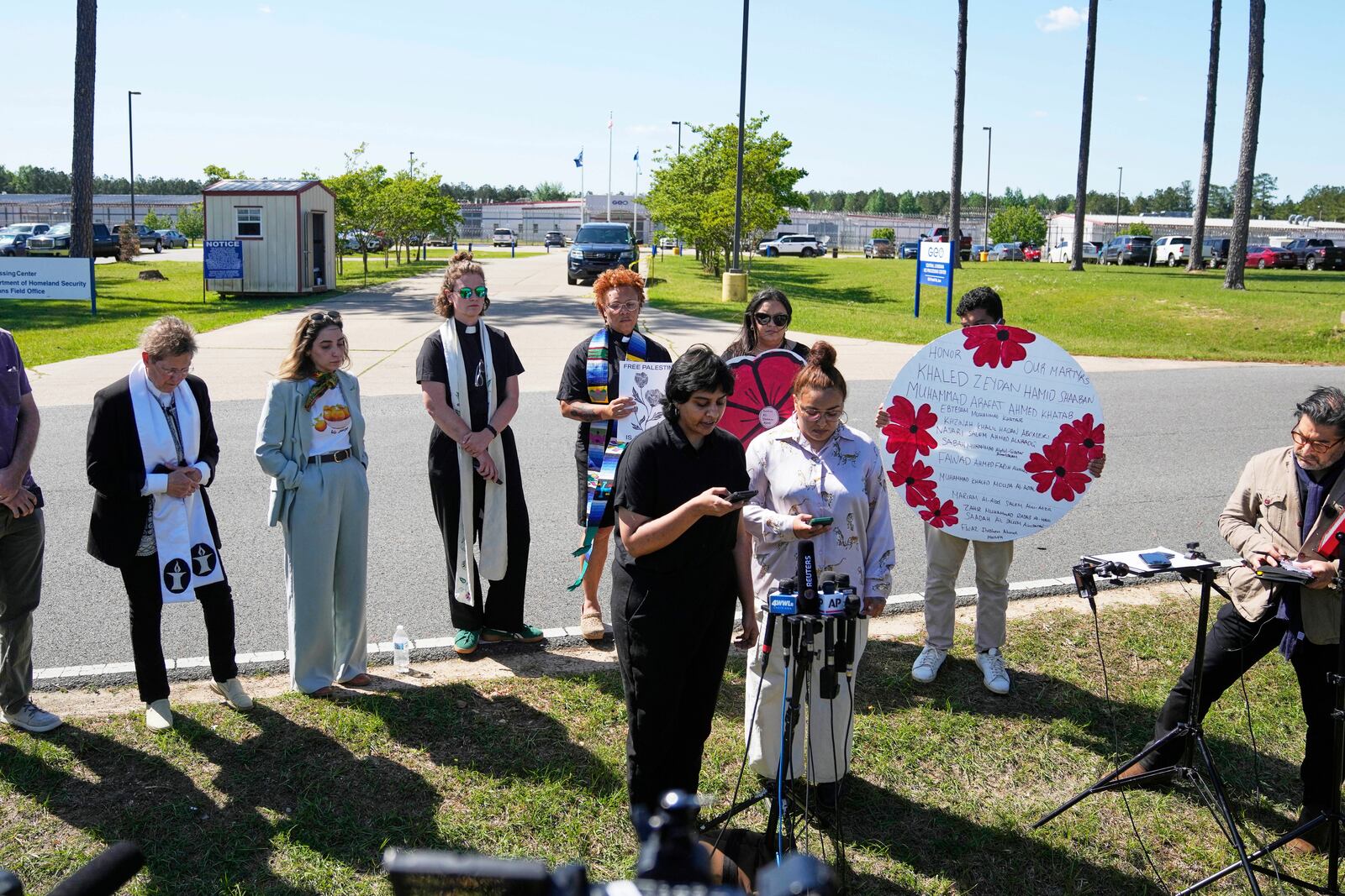 Supporters speak outside the Central Louisiana ICE Processing Center in Jena, La., after an immigration hearing for Mahmoud Khalil, the Columbia University activist facing deportation for his role in pro-Palestinian campus protests, Friday, April 11, 2025. (AP Photo/Gerald Herbert)