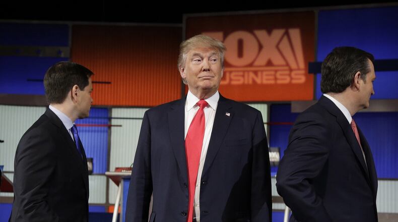 Republican presidential candidate, businessman Donald Trump stands on the stage before the Fox Business Network Republican presidential debate at the North Charleston Coliseum, Thursday, Jan. 14, 2016, in North Charleston, S.C. (AP Photo/Chuck Burton)