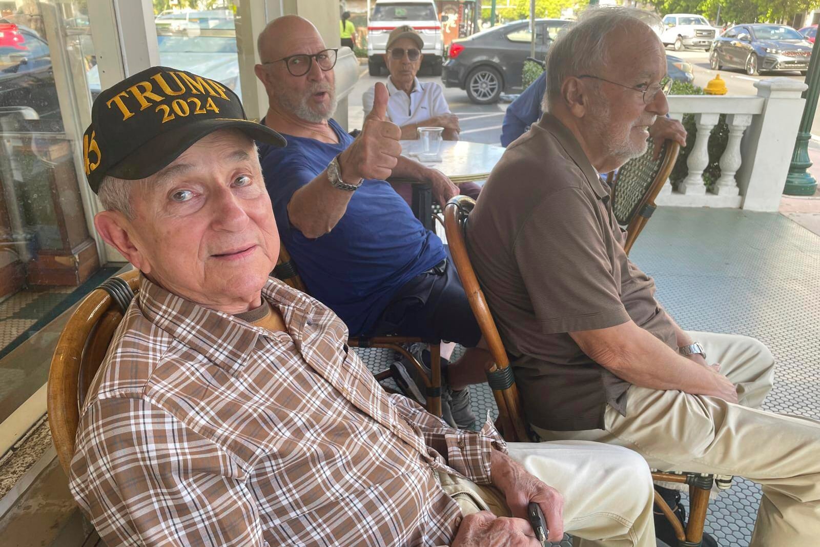 In this undated photo MAGA fans hang out at Café Versailles in Little Havana, Miami, Fla. (AP Photo/Josh Goodman)