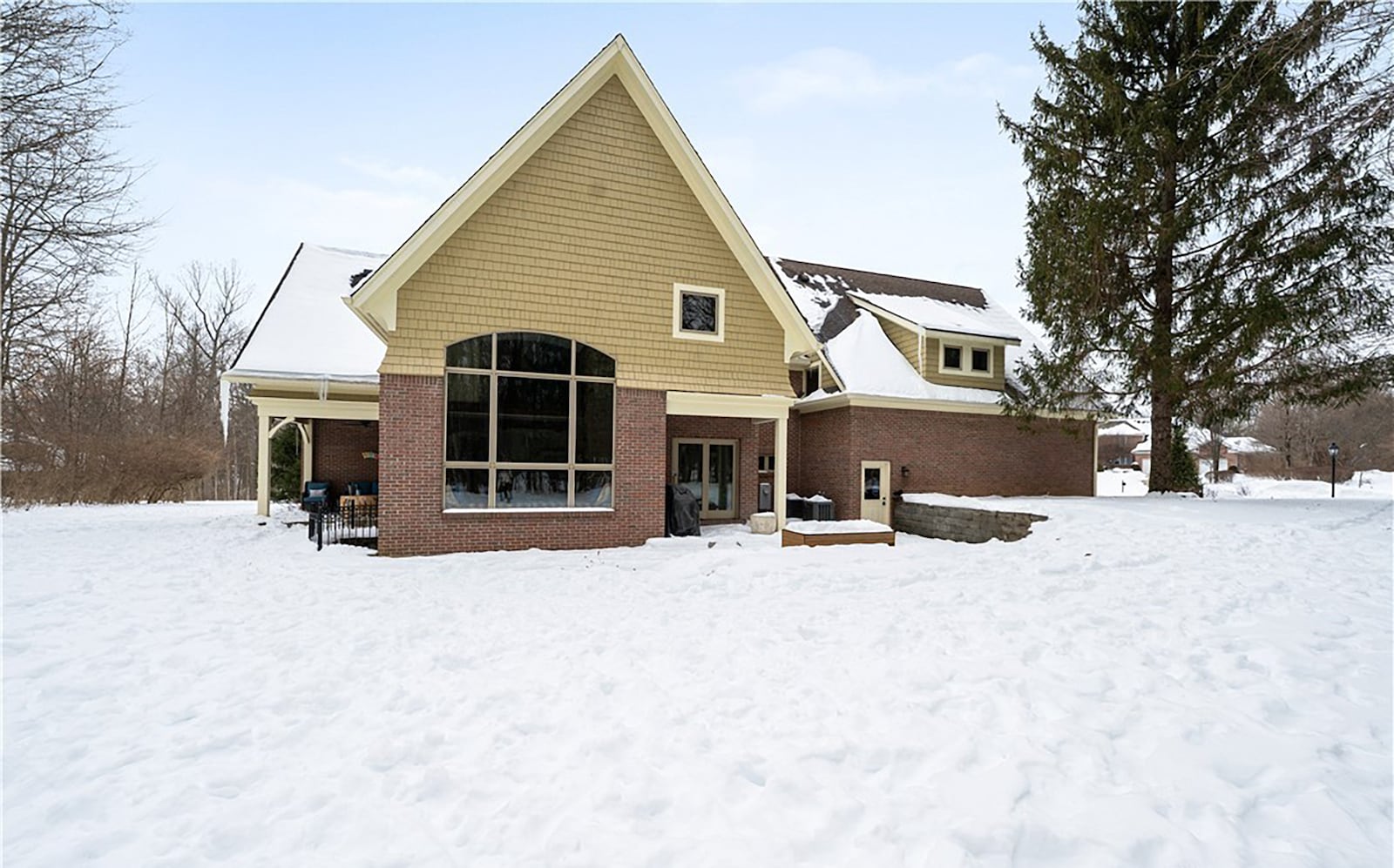 The back of the home features two covered patios and a retaining wall. The lot is heavily wooded and there no rear neighbors. CONTRIBUTED