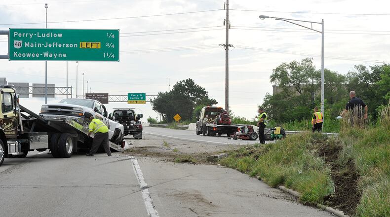 A crash involving a pickup truck that was hauling lawn mowers closed the I-75 north and south ramps to U.S. 35 east on Monday, Aug. 3, 2020. Staff Photo / MARSHALL GORBY