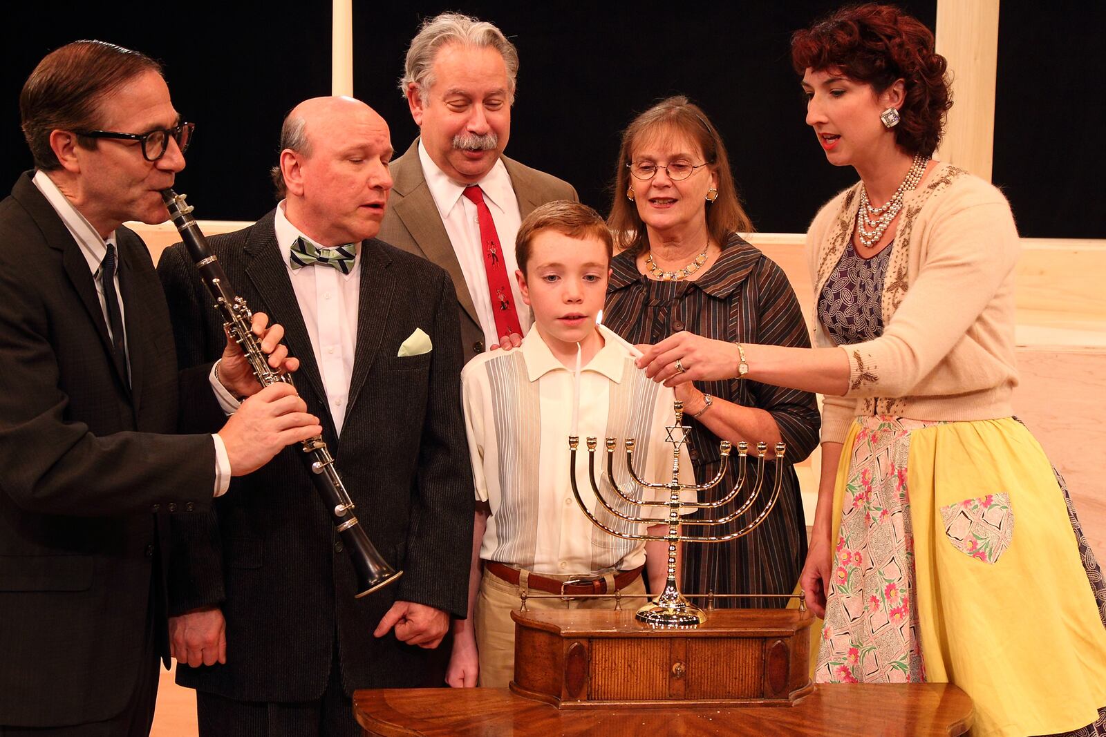 The Gellman Family (featuring KL Storer as Grandpa Gellman, second from left) celebrates Chanukah in The Human Race Theatre Company's 2011 production of "Caroline, or Change.'' CONTRIBUTED 