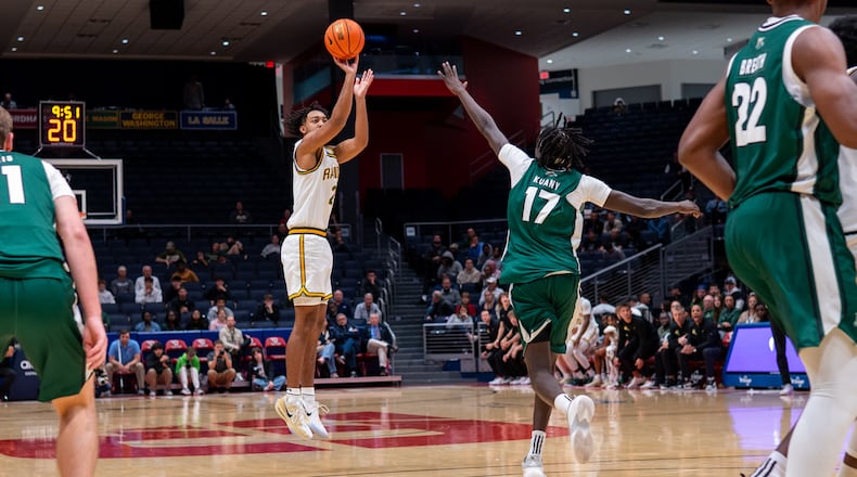 Wright State University guard Logan Woods shoots over an Ohio University defender during their preseason game on Monday, Oct. 20 at UD Arena. The Raiders beat the Bobcats 63-57. WRIGHT STATE ATHLETICS / CONTRIBUTED PHOTO