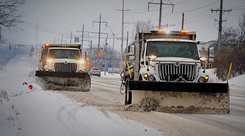 Beavercreek Road crews were out working early Thursday morning, February 18, 2021 on Colonel Glenn Highway. MARSHALL GORBY\STAFF