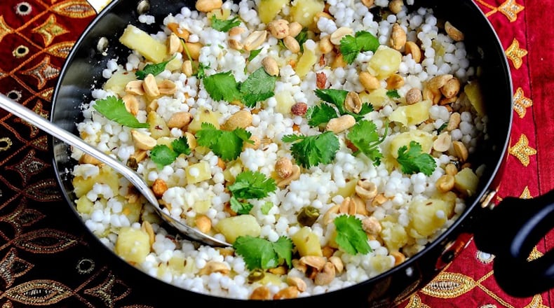 Sabudana khichdi is made with tapioca pearls, cubed potatoes, peanuts, green chilies and lime juice, garnished with cilantro. (Lake Fong/Pittsburgh Post-Gazette/TNS)