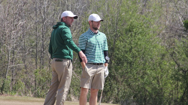 Wright State golf coach Brian Arlinghaus talks to No. 1 player Chris Rossi during the Big Blue Intercollegiate earlier this spring. CONTRIBUTED