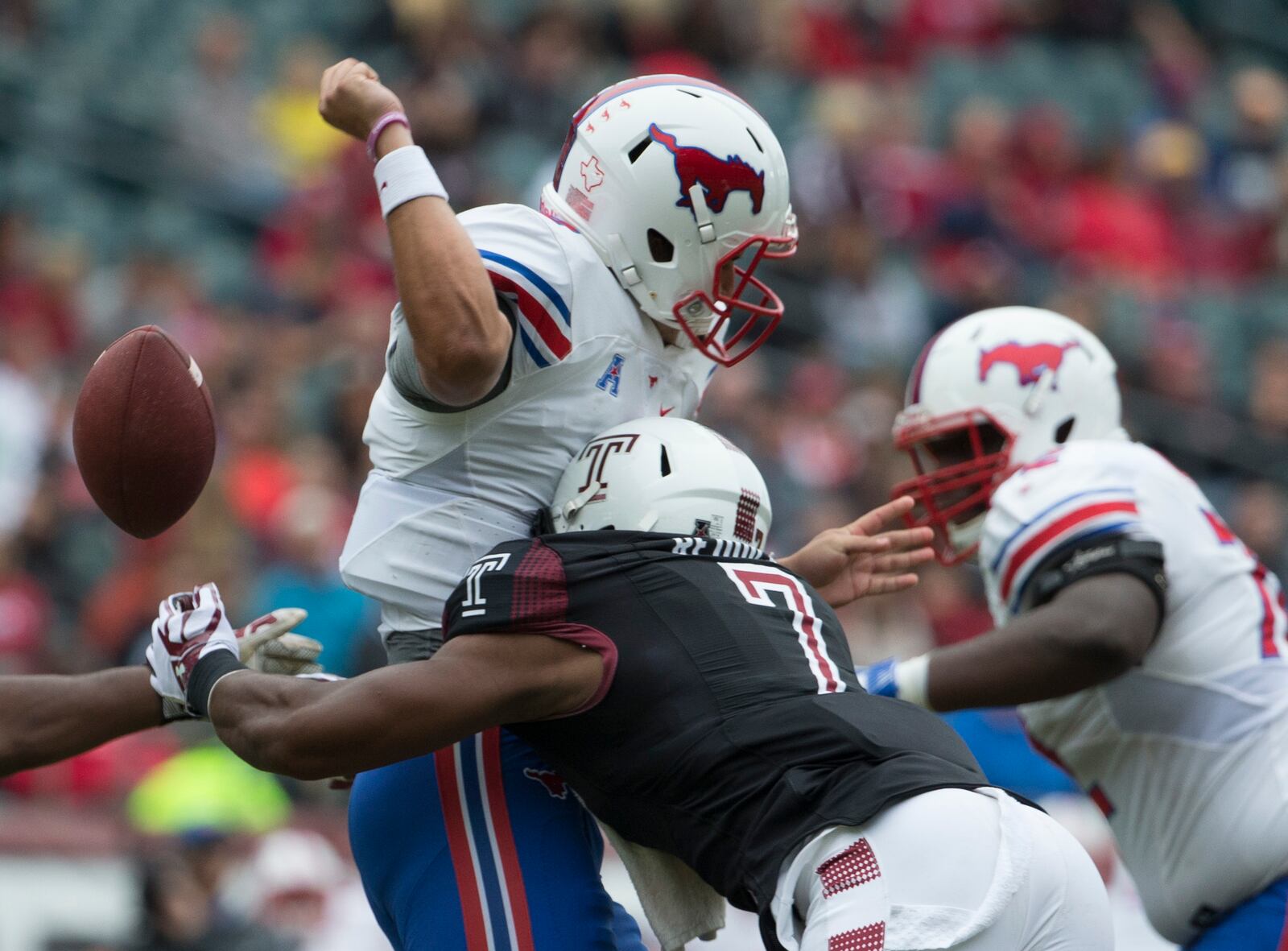 PHILADELPHIA, PA - OCTOBER 1: Haason Reddick #7 of the Temple Owls forces a fumble against Ben Hicks #8 of the Southern Methodist Mustangs in the second quarter at Lincoln Financial Field on October 1, 2016 in Philadelphia, Pennsylvania. (Photo by Mitchell Leff/Getty Images)