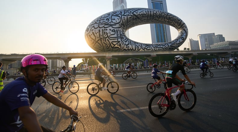 Bicyclists ride along Sheikh Zayed highway during the Dubai Ride annual event in Dubai, United Arab Emirates, Sunday, Nov. 2, 2025. (AP Photo/ Fatima Shbair)