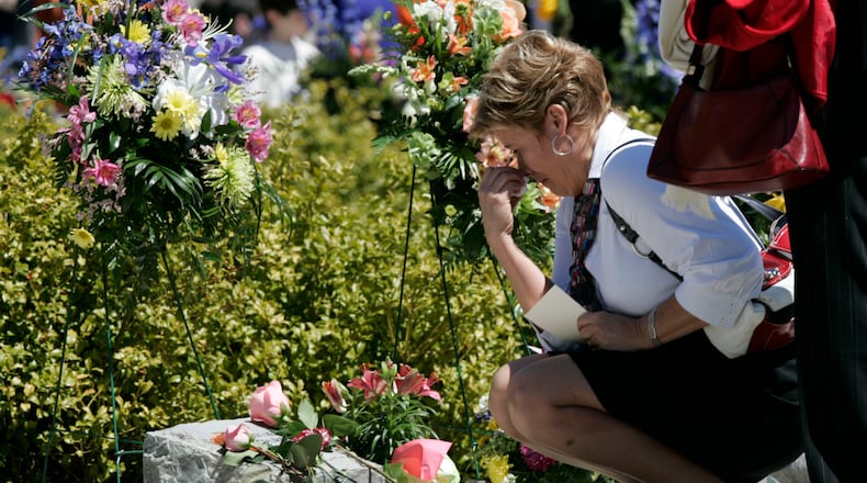 One of the deadliest campus shootings in American history took place at Virginia Tech in 2007. Here, in this archive photo, an unidentified family member wipes her face as she placed a flower on a memorial marker during ceremonies marking the second anniversary of the April 16, 2007 shootings at Virginia Tech on the campus of the school in Blacksburg, Va., Thursday, April 16, 2009. (AP Photo/Steve Helber)