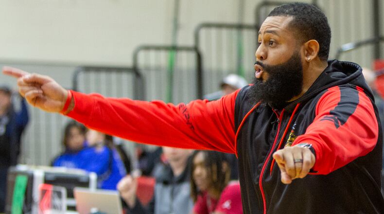 Anthony Parker is in his fifth season as the boys basketball coach at West Carrollton. He will also coach the Pirates' football team in the fall and continue as the basketball coach. CONTRIBUTED/Jeff Gilbert